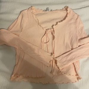 Tie front top with subtle ruffles, never worn.